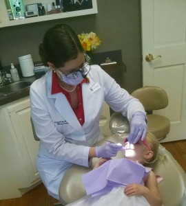 Dr. Erin Brown Treating Pediatric Patient